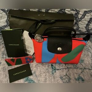 Longchamp Robert Indiana LOVE Pouchette w receipt plastic still on zipper pull